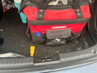Husky tool bag with tools hard hat hammer staple gun crow bar screw drivers Allen keys