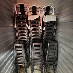 Distressed copper chairs and tall stools