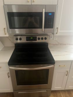 Stainless steel stove and microwave in good condition