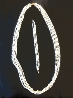 14 k.. Gold.. With baby pearl