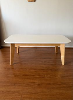 Rounded wooden coffee table
