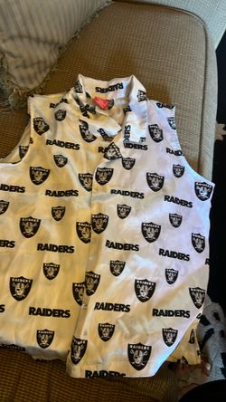This white sleeveless vest features a repeating pattern of the Las Vegas Raiders logo and wordmark.