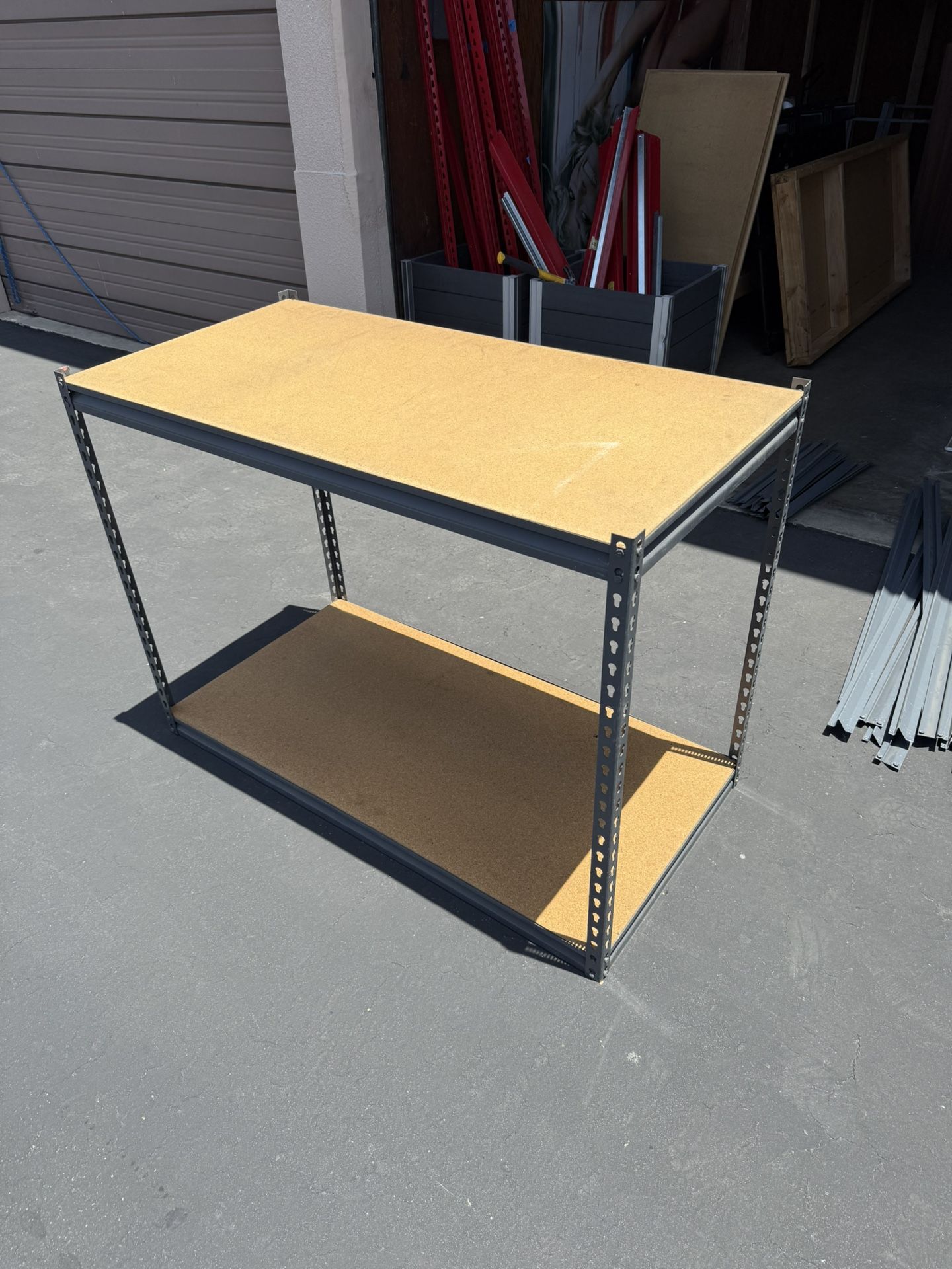 Boltless Industrial Metal Shelving With Particleboard Shelves.