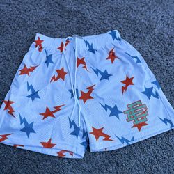 White bape with blue and orange stars size medium