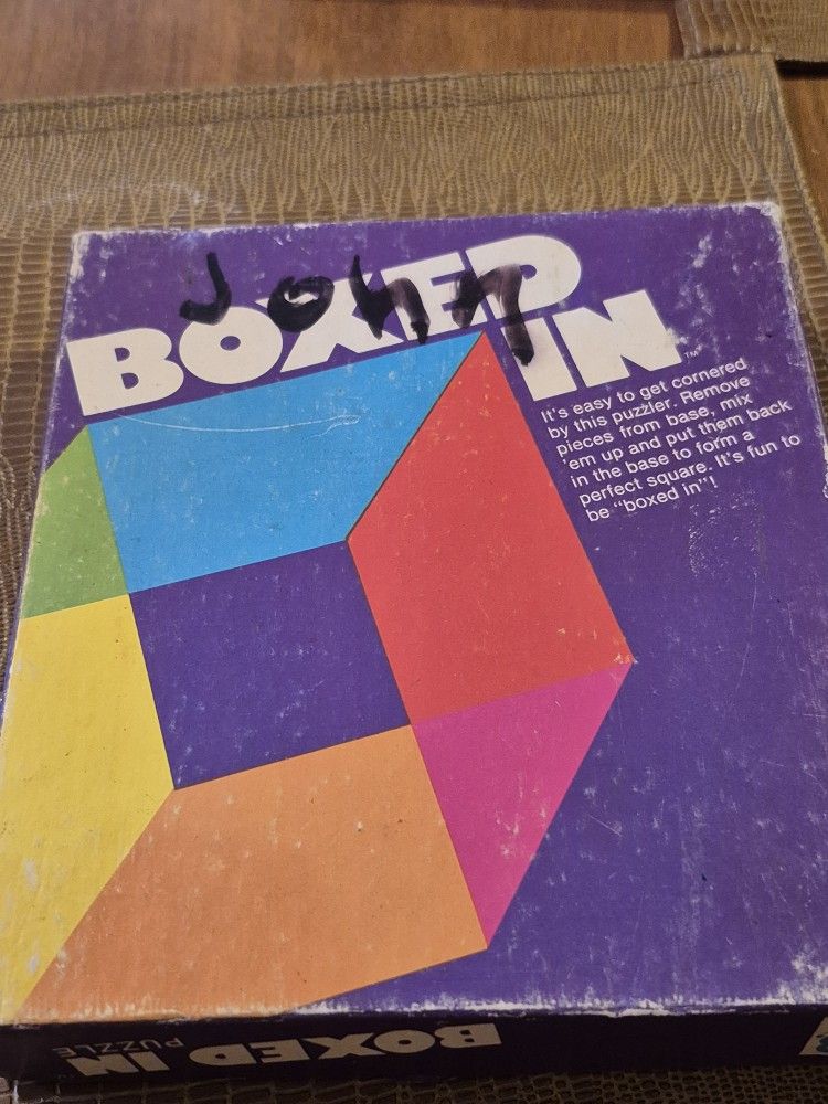 Two vintage Games Boxed In and It's Not Easy