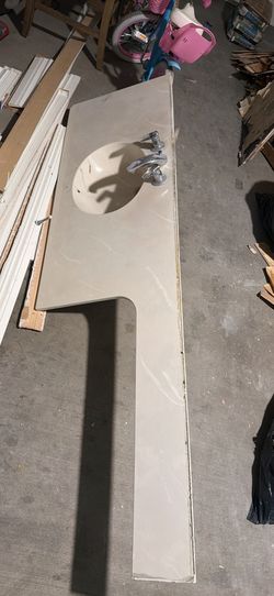 vanity top features a pre-drilled faucet set and an integrated sink basin.