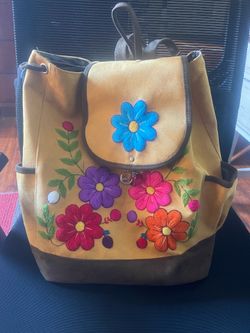 Mustard floral embroidered suede backpack