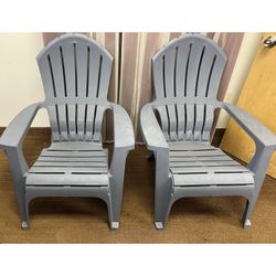 (2) Stackable gray resin Adirondack chairs. $15ea. Outdoor patio deck stacking chairs