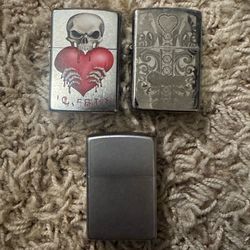 Three Zippo lighters