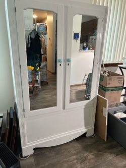 Older freestanding wood closet. 22 x 40 x 65