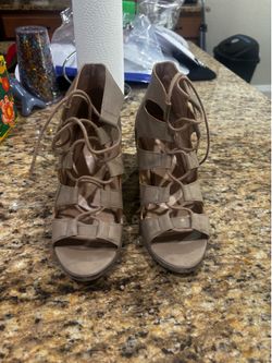 Stainless top sandals  size 9  with a lace up front open toe design