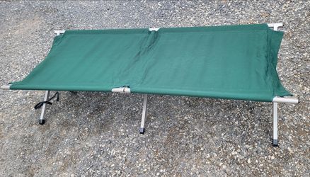 Green military style camping cot