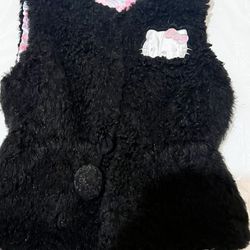 Hello Kitty black faux fur vest. Very cute and stylish. Worn only a few times.  Great condition Size Medium.