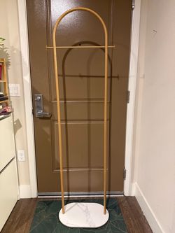 Gold Clothing Rack with Marble-Look Base – $35