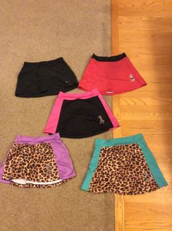 Running skirts brand (4 skirts with attached brief) and One XS Nike running skirt with pockets