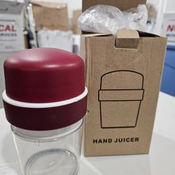 New handy hand juicer and container.