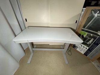 47″ Curved, Power Sit-Stand Desk by Tresanti with wireless charger. Somewhat used, works great.