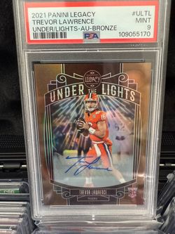 2021 Panini Legacy Trevor Lawrence "Under the Lights" bronze autographed rookie card, graded PSA 9 Mint.