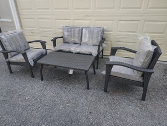 Outdoor patio wicker couch with chairs and coffee table 