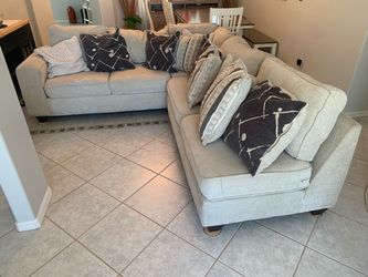 Very nice L shaped couch with pillows