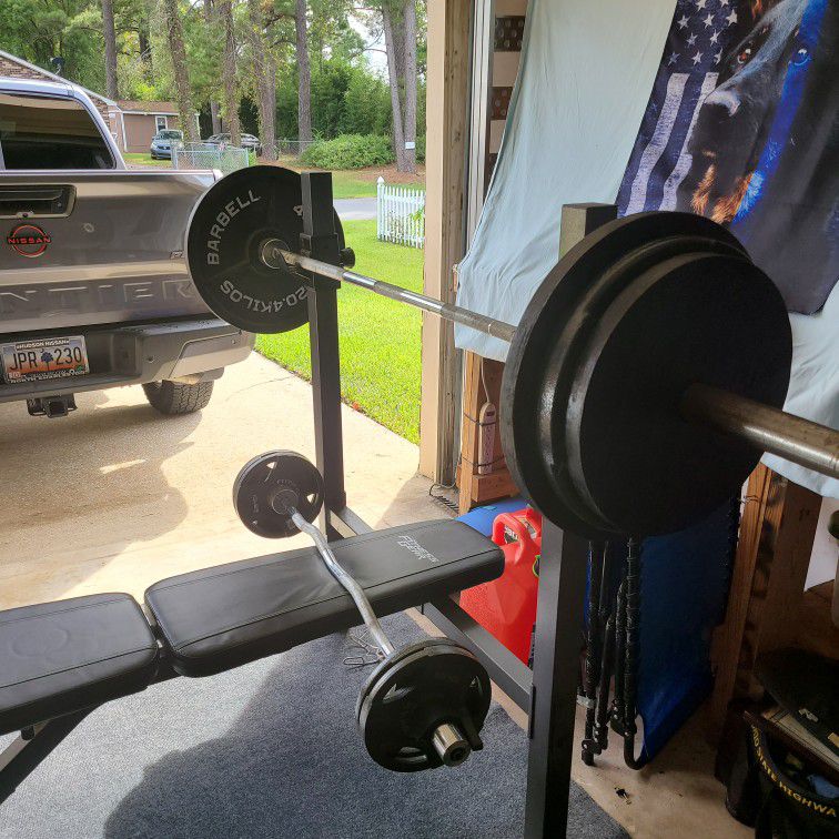 Weight Bench + 330lbs Of Plates + 2 Bars