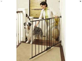 Pets gate new in box opening up to 42 inches wide adjustable