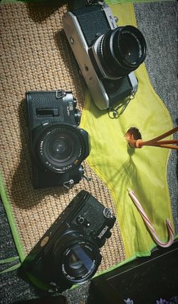 bag of vintage cameras and camera supplies