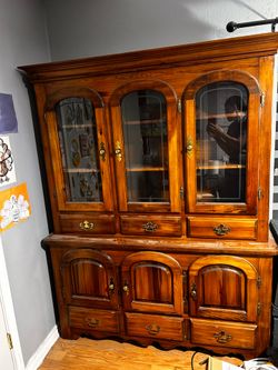 Early American maple china cabinet