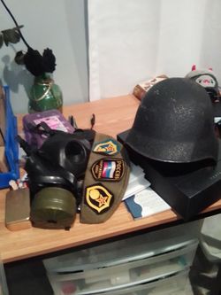 WwII swiss army helmet , German gas mask , Russian hat with pins and patches