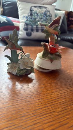 Two hummingbird figures