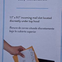 This is an Architectural Mailboxes Chelsea Black Wall-Mounted Mailbox.
 
It has a key lock 