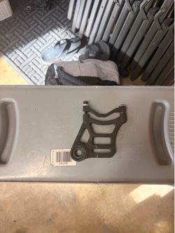 Talaria brake mount with spacer and bolts