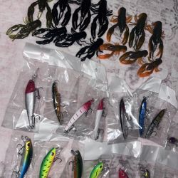 15 unopened hard lures and 14 soft plastics 