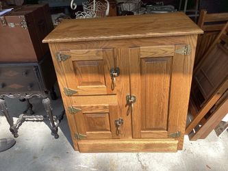 Antique ( reproduction)ice box cabinet has 3 shelves 2 adjustable oak very heavy  inperfection on th3 top thus the price 33.5 wide-17 deep-36 tall …mu
