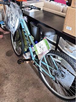 Brand new mountain bike with helmet (tag)