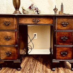 An English, Edwardian hand carved pedestal desk, on 8  cabriolet feet.  Fine Mahogany smooth top, one frieze drawer,  three dovetail drawers on each s