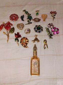 16 Vintage Brooches mostly from Avon.