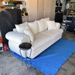 White striped sofa couch
