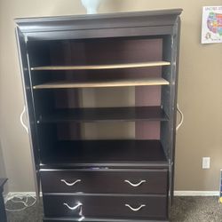 Brown wooden Armoire wardrobe with shelves and drawers