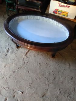 Antique Glass and cushioned display coffee table