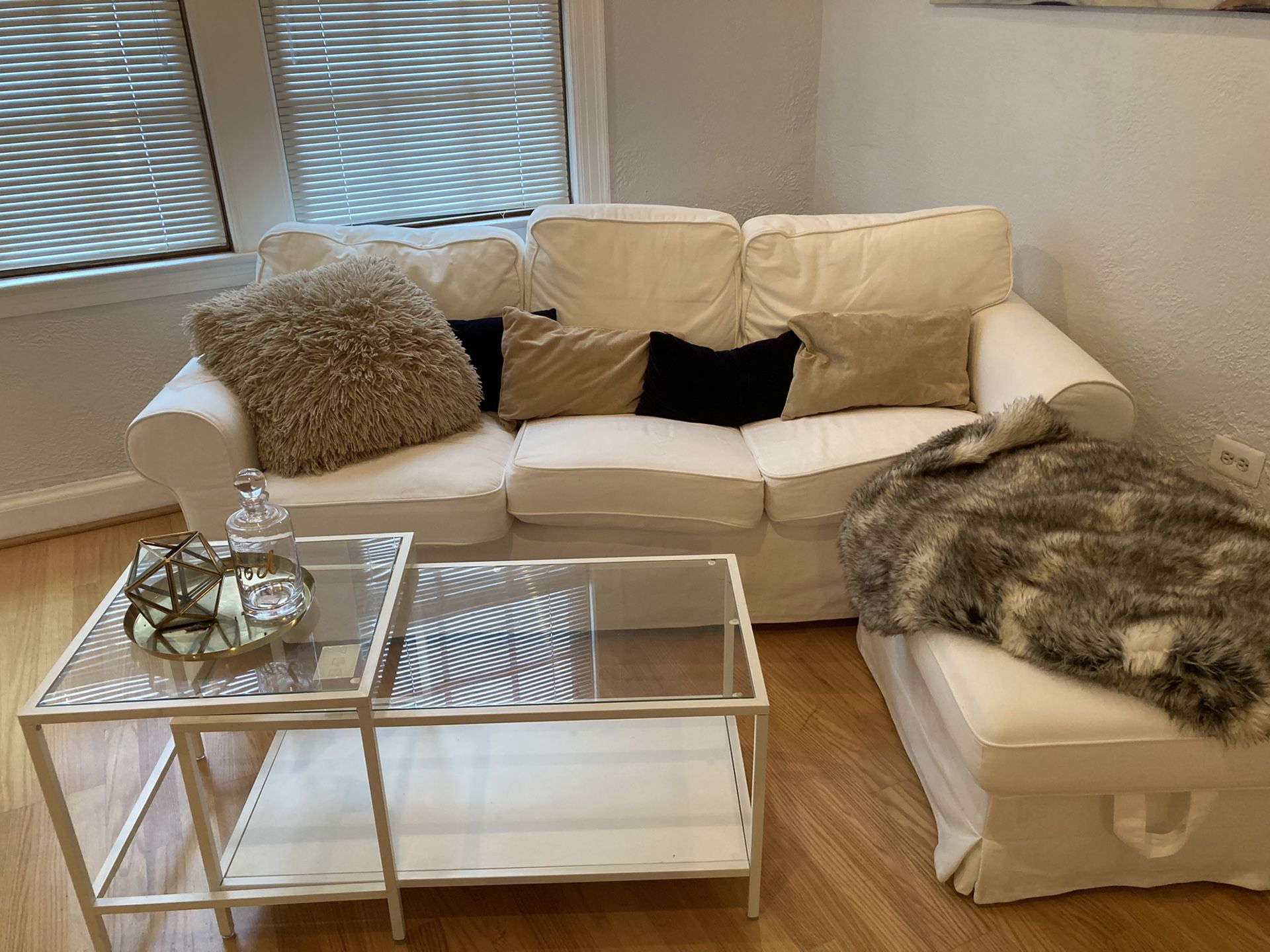 White IKEA couch and storage ottoman