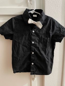 Black button up short sleeve kids shirt with tie.