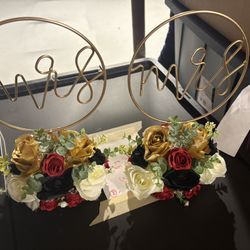 Mrs And Mrs Stands With Flowers 