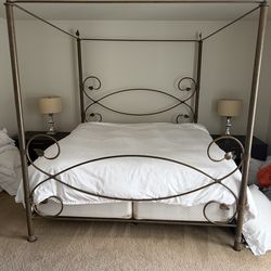 King metal canopy bed and glass top console table