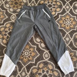 Grey and White Nike windbreaker pants