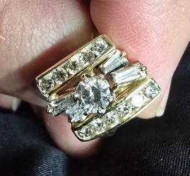 14K Gold Diamond Ring with large 5.2mm round center stone and smaller diamonds size 7 weighs 6grams.