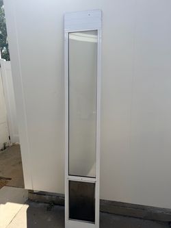 Dog door for sliding door