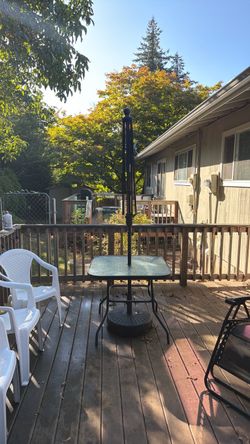 Outdoor Patio Table. Just needs new umbrella