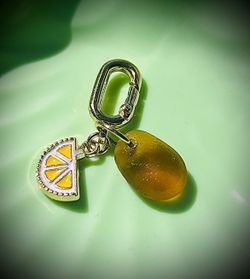 Amber-colored sea glass on swimwear jewelry