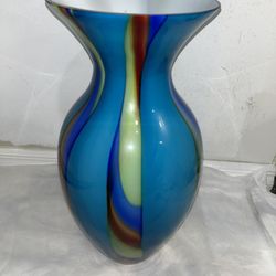 Vintage glass vase with a rainbow  design.  